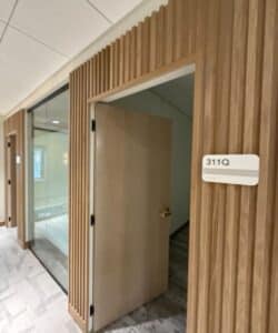 gc-commercial-william-and-mary-provost-office-suite-wood-paneling-renovation-williamsburg-va Provost Office entrance with wood slat paneling at Blow Hall renovation by GC Commercial Williamsburg VA