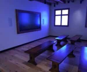 Renovated interactive exhibit room with custom benches at Jamestown Settlement Main Gallery